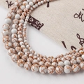 White synthetic turquoise round beads with orange-brown veins for DIY jewelry making - Gold Line Turquoise-151