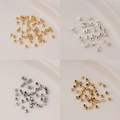Detailed grid view of triangular metal spacers in gold, silver, and steel for DIY jewelry - 2.5mm Arc Triangle (5g, approx 160 pcs) / 14K Gold