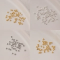 Macro view of square metal spacer beads in gold and silver for DIY jewelry making - 2mm Straight Hole Square (5g, approx 240 pcs) / 18K Gold