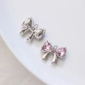 Colgante de lazo con cristales de corazón rosa y base de metal plateado para joyas - Bañado en oro blanco Circonita rosa