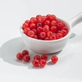 Polished red 8mm round resin beads for DIY jewelry making on white ceramic spoon - 10 Pieces Pack / 8mm Gilded Dark Red