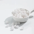 Translucent white round beads for DIY jewelry making displayed on a white ceramic spoon - 10 Beads / 8mm / Gilded White