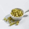 Polished light green cat-eye beads for DIY jewelry making in a white ceramic bowl - 10 Beads / 8mm Gilded Grass Green