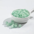 Light green cat eye glass beads for DIY jewelry in a white ceramic spoon - 8mm / 10 Beads / Gilding Lake Green