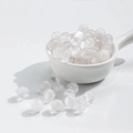 White iridescent cat eye resin beads in a white ceramic spoon for DIY jewelry making - 10 Beads / 10mm Transparent White Cat Eye