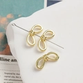 Perlina in lega dorata a forma di fiocco traforato per gioielli DIY e accessori capelli - Oro