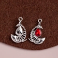 Gothic silver scorpion charms featuring a deep red teardrop-shaped gemstone inlay - Silver-Red Zircon