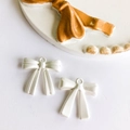 Set of two white matte alloy bow charms for DIY jewelry making and necklace design - Matte Silver
