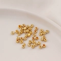 Close-up of golden metallic glass spacer beads for DIY jewelry making and crafts - 2*2mm (Aperture approx 1mm) / 10g Pack / Gold