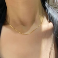 Close-up of minimalist 18k gold plated stainless steel snake chain on a woman neck - 1.0 Round Snake Chain Necklace (Gold)