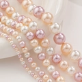 Macro detail of multi-size round glass pearls in white, champagne, and pink tones - 4mm / 2# Three Color Mix