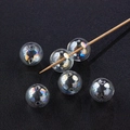 Iridescent AB glass bubble beads for DIY jewelry making on dark textured background - 12mm / Iridescent Opposite Holes