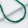 Deep green malachite rectangular beads for DIY jewelry on a white stone background - Stone Green