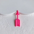 Macro detail of pink arrow-shaped resin charms with vertical texture for DIY crafts - Pink Arrow Style