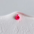 Macro shot of bright pink music note shoe charm with a small loop for DIY jewelry - Rose Pink Mini Cup Style