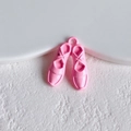 Macro shot of pink enamel ballet shoe pendants for DIY jewelry making and crafts - Light Pink Ballet Shoes Style