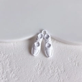 Detail of white ballet shoe alloy pendant charm with glossy finish for DIY jewelry crafts - White Ballet Shoes Style