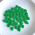 Detailed view of green hollow heart alloy beads for DIY jewelry and hair accessories - Green