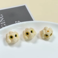 Macro detail of three cream resin puppy beads for DIY jewelry with curly fur textures - Cream (3#)
