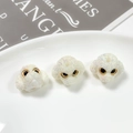 Macro view of three white pearlescent poodle beads with glitter finish for DIY jewelry - Iris White (8#)