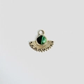 Detailed view of fan-shaped golden pendant with a malachite stone inlay and retro carvings - Malachite