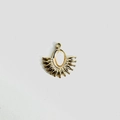 Detailed view of a gold-tone fan-shaped pendant with an oval yellow natural stone inlay - White Shell