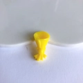 Macro detail of a bright yellow resin candy bouquet charm for DIY jewelry and crafts - Yellow