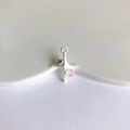 Detailed macro view of silver cross pendant with pink gemstone for DIY jewelry projects - Matte Silver with Light Pink