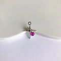Macro shot of silver alloy cross pendant with purple gemstone for DIY jewelry making - White Gold Plated with Deep Pink