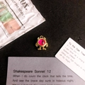 Macro shot of gold-tone monster pendant with magenta eye detail for DIY jewelry - Pink Eye Gold Base