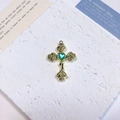Detailed view of alloy cross pendant with heart turquoise gem and rose relief - Rose Heart Cross / Lake Blue + Gold