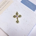 Detailed close-up of a gold cross pendant with rose engraving and a purple heart gemstone - Rose Heart Cross / Purple + Gold