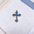 Macro shot of silver cross pendant with heart-shaped gem and rose flower carvings - Rose Heart Cross / Blue Purple + White K