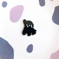 Detailed view of a cute black enamel puppy brooch with glossy finish and minimalist design - Black Puppy