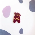 Detailed view of a dark red glossy acrylic bear charm with gold facial accents and cute design - Dark Red Standing Dog
