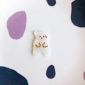 Detailed top view of white pearl resin bear charm with golden facial details and paw prints - White Marble Standing Dog