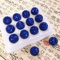 Gros plan de 14 perles disco bleues brillantes avec trous pour la création de bijoux DIY - Style Laser Disco Rond / 16mm / Bleu clair