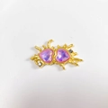 Detailed view of alloy double heart pendant with purple crystals and gold splash frame - Deep Pink Matte Gold Heart