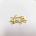 Macro view of gold liquid metal frame with twin iridescent heart crystals and rhinestones - Clear Matte Gold Heart