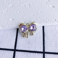 Close-up of golden bow pendant with purple heart-shaped cubic zirconia inlay - Purple Heart Gold Base (1#)