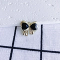 Macro view of golden bow pendant with two black heart-shaped gemstones for DIY jewelry - Black Heart Gold Base (2#)