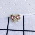 Detailed view of a golden bow pendant with pink heart crystals for DIY jewelry making - Pink Heart Gold Base (4#)