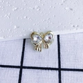 Macro detail of golden bow charm with heart-shaped zircon inlays for jewelry making - Clear Heart Gold Base (6#)