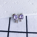 Macro detail of purple heart zircon bow pendant with silver-tone textured metal - Purple Heart Silver Base (8#)