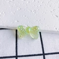 Macro shot of translucent iridescent butterfly charm with textured finish for DIY jewelry - Aurora Iridescent Green Purple (13#)