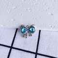 Close-up of bow-shaped pendant with heart-shaped blue crystals and silver metal frame - Blue Heart Silver Base (11#)
