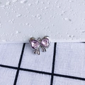Detail shot of silver bow pendant featuring two pink heart-shaped zircon stones - Pink Heart Silver Base (13#)