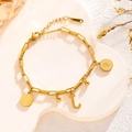 Golden hip hop chain bracelet featuring coin charms and capital letter L pendant - Queen Portrait - Letter J (7836)