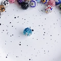 Macro detail of a 10mm sparkling blue rhinestone disco ball bead for DIY jewelry making - Size 6