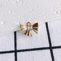 Macro shot of gold bow pendant with square zircon inlay and detailed pleated metal texture - Gold Bow With Transparent Stone (4#)